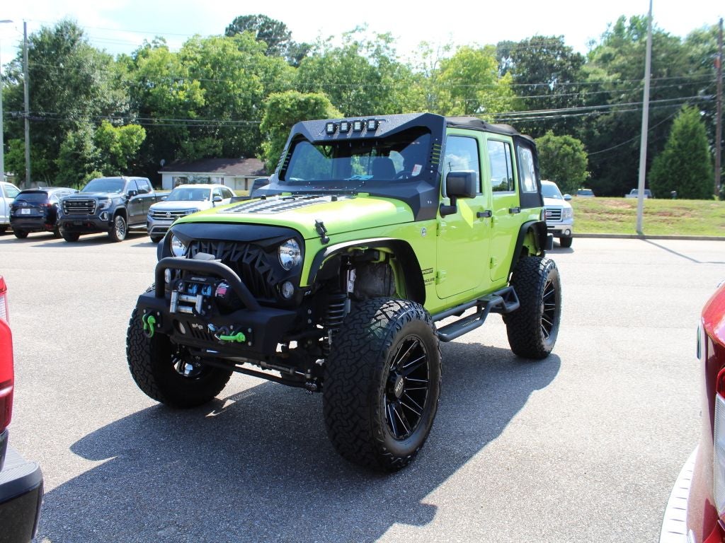 Used 2016 Jeep Wrangler Unlimited Sport with VIN 1C4BJWDG3GL277962 for sale in Ozark, AL