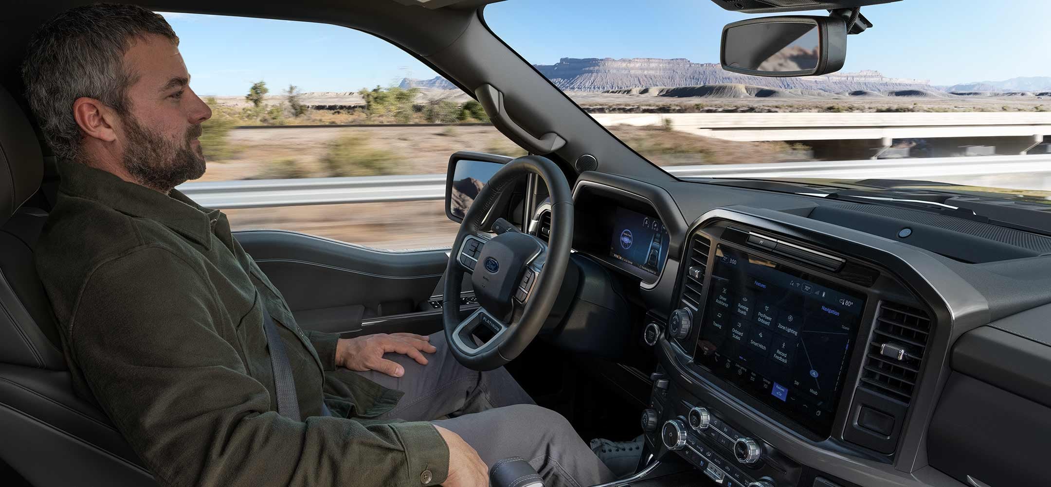 Man using the Ford BlueCruise hands-free driving feature on a 2025 Ford F-150® pickup